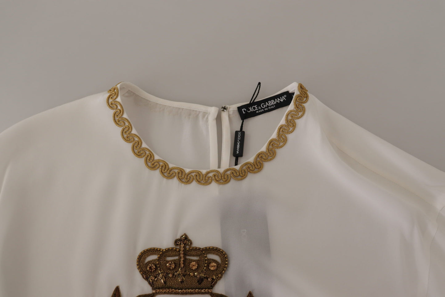 Dolce & Gabbana Élégant chemisier en soie avec broderie couronne dorée