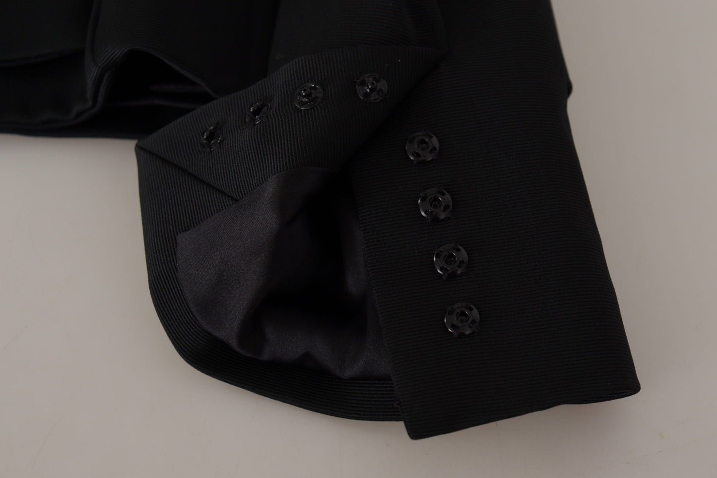 Dolce & Gabbana - Veste noire élégante à boutons-pression avec doublure en soie