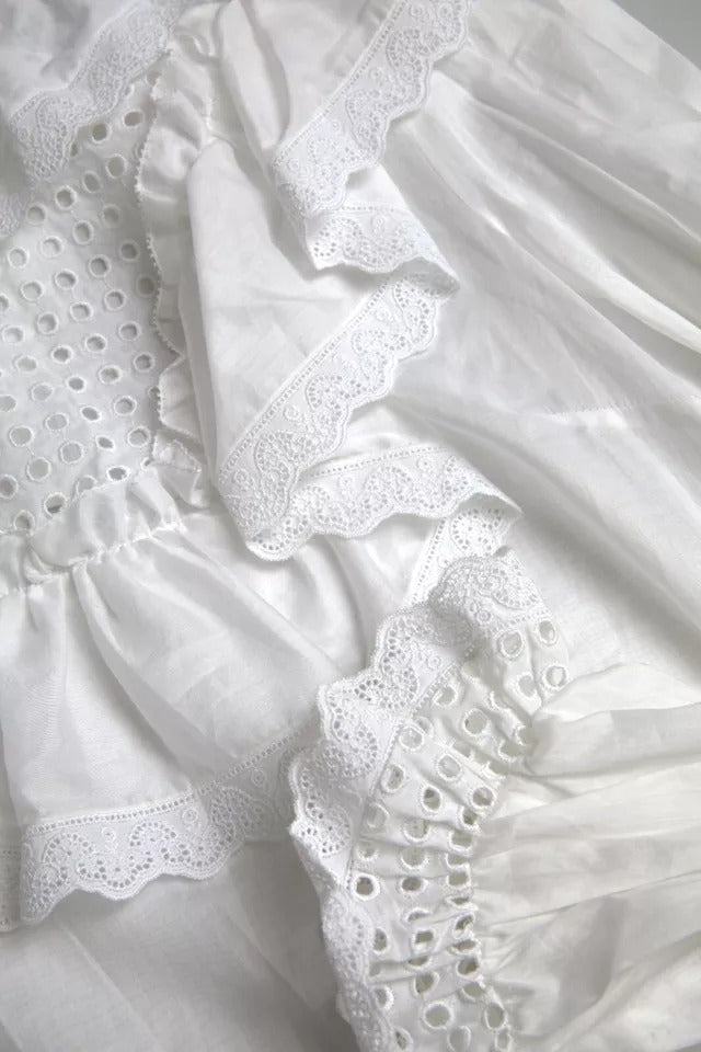 Chemisier à col roulé en coton blanc avec bordure en dentelle Dolce & Gabbana