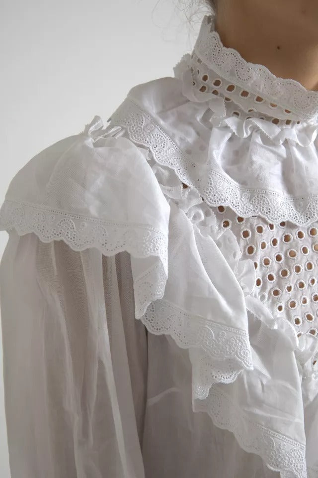 Chemisier à col roulé en coton blanc avec bordure en dentelle Dolce & Gabbana