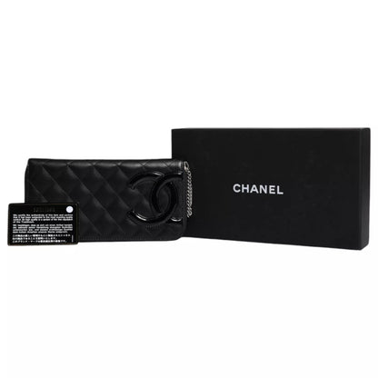 Portefeuille zippé continental Chanel en cuir matelassé noir avec logo CC