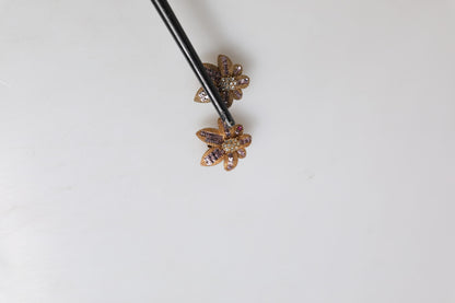 Boucles d'oreilles à clip Dolce &amp; Gabbana en laiton doré et cristaux violets en forme de fleur
