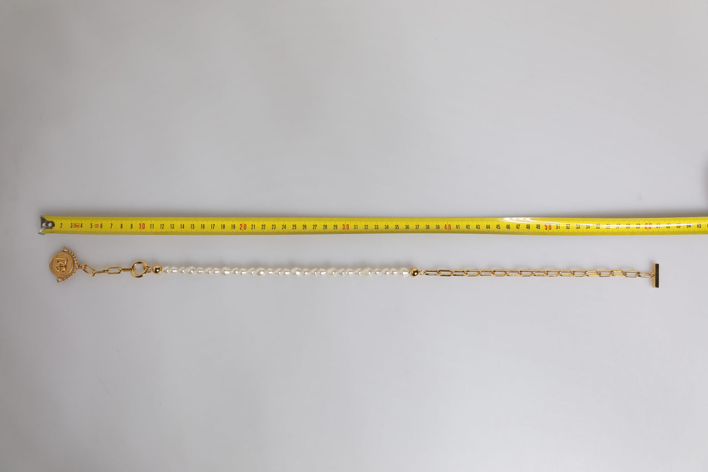 Collier Dolce &amp; Gabbana avec pendentif logo en fausse perle et chaîne en or