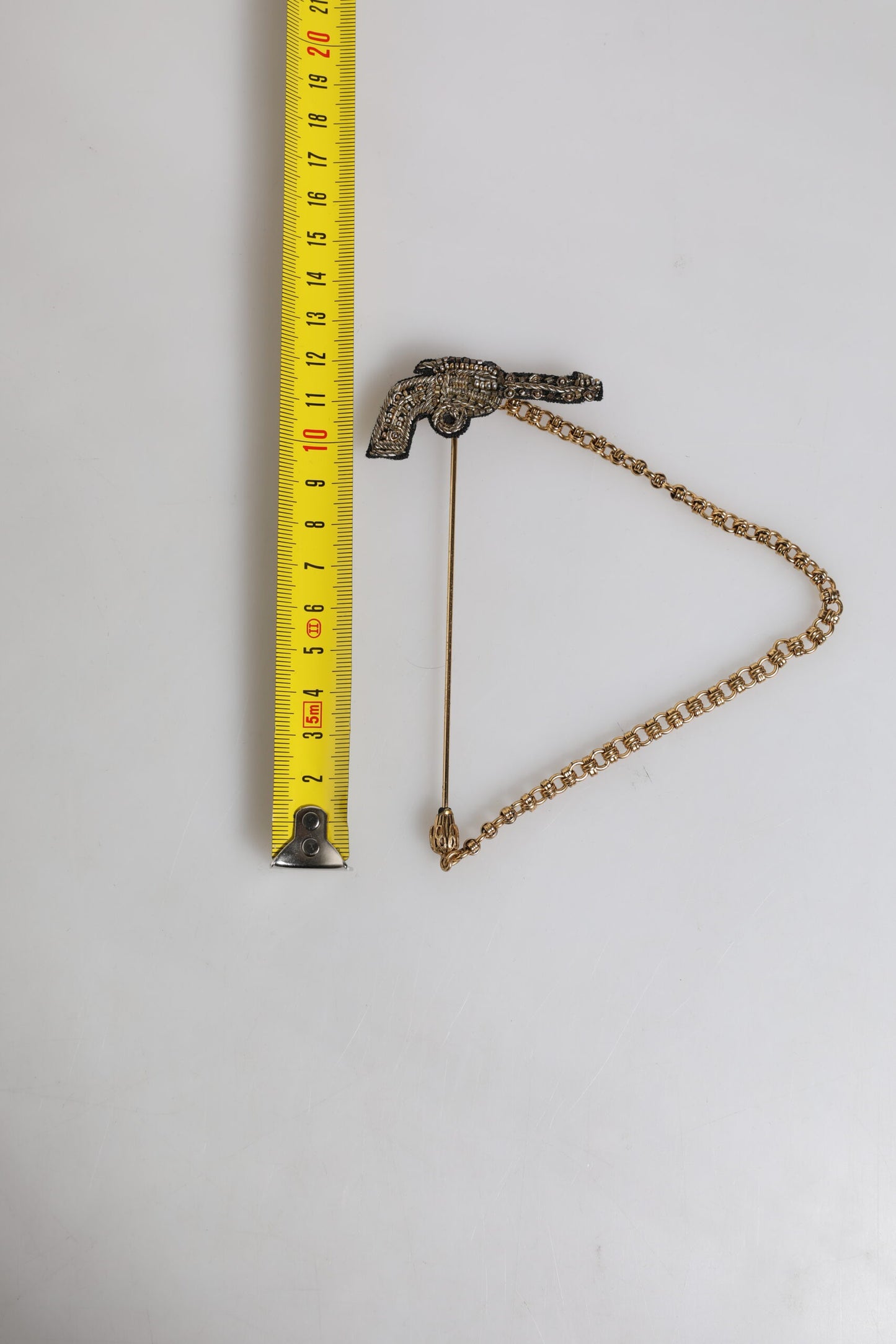Broche revolver Dolce &amp; Gabbana en laiton doré noir et cuivre
