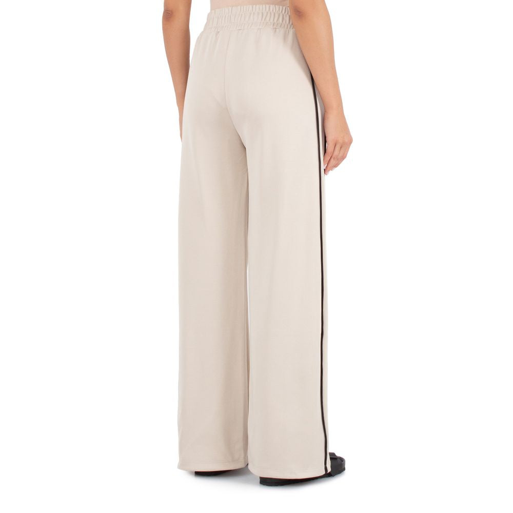 Comme Des Fuckdown Beige Cotton Jeans & Pant by Comme Des Fuckdown